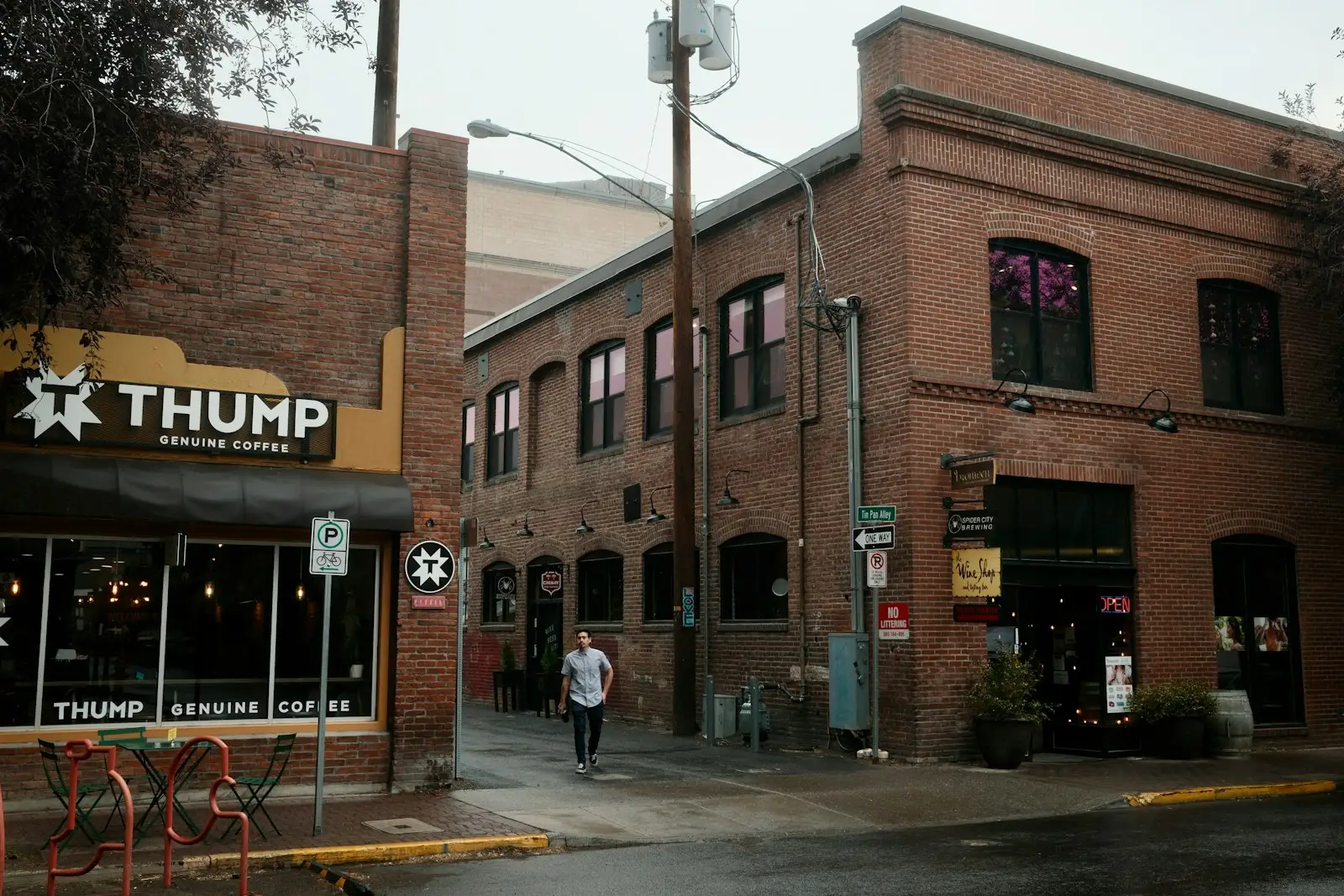 Brick buildings and a coffee shop at the entrance to Tin Pan Alley in downtown Bend, Oregon.