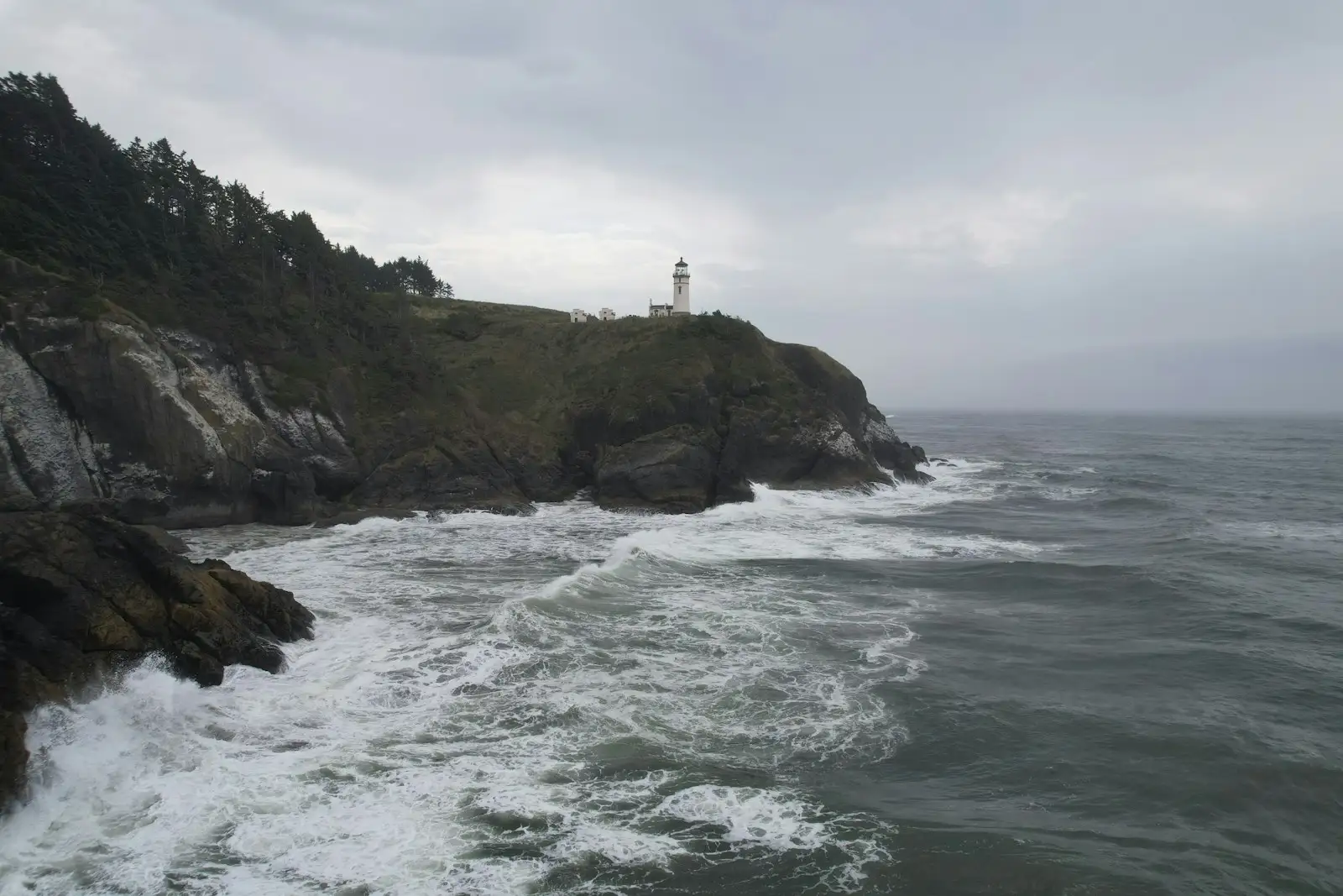 A lighthouse standing on the rocky coast near Long Beach, Washington.